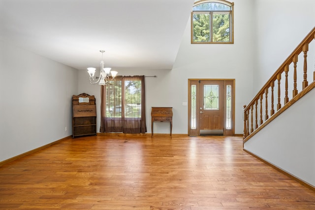 2946 County Road 800 E, Dewey, IL 61840 - entrance foyer with healthy amount of natural light, a chandelier, light wood-style floors, and a high ceiling