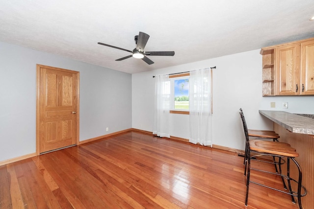 2725 2100n Rd, Minonk, IL 61760 - unfurnished dining area featuring light wood-style floors, ceiling fan, and baseboards