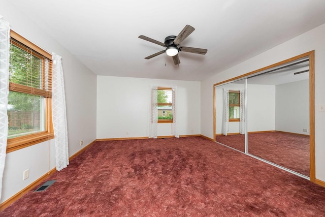 2725 2100n Rd, Minonk, IL 61760 - unfurnished bedroom with baseboards, carpet, a closet, and a ceiling fan
