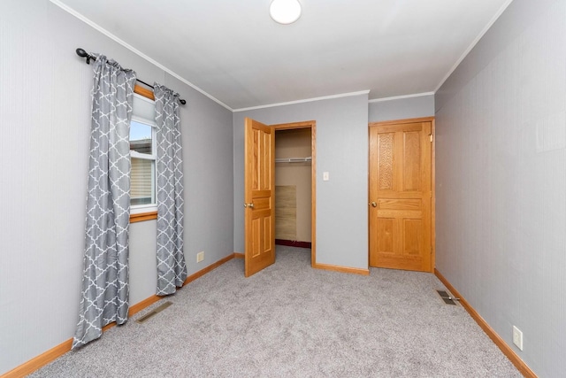 2725 2100n Rd, Minonk, IL 61760 - unfurnished bedroom featuring carpet floors, crown molding, baseboards, and a closet