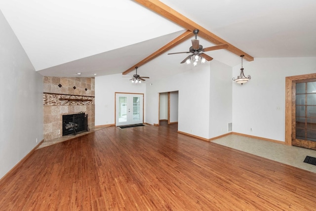 2725 2100n Rd, Minonk, IL 61760 - unfurnished living room featuring wood finished floors, a large fireplace, baseboards, and a ceiling fan