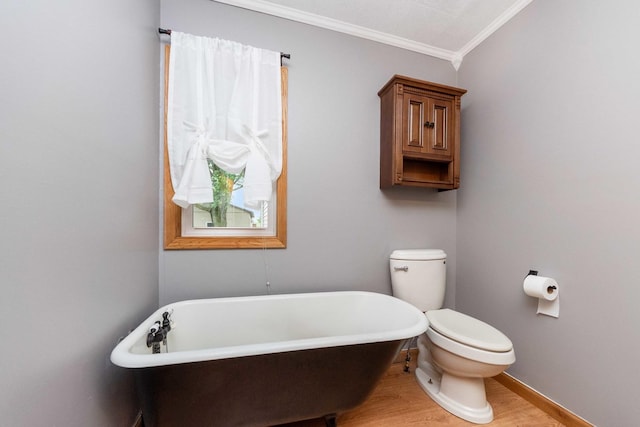 2725 2100n Rd, Minonk, IL 61760 - full bathroom with crown molding, a freestanding bath, wood finished floors, toilet, and baseboards
