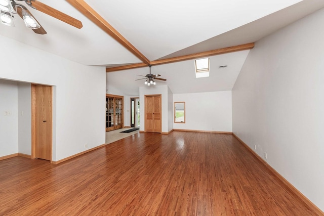 2725 2100n Rd, Minonk, IL 61760 - unfurnished living room featuring a ceiling fan, lofted ceiling, wood finished floors, and baseboards