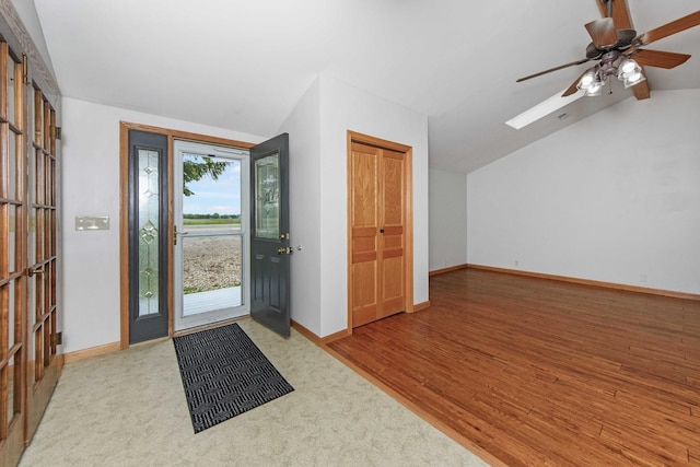 2725 2100n Rd, Minonk, IL 61760 - foyer featuring vaulted ceiling, baseboards, ceiling fan, wood finished floors, and a skylight