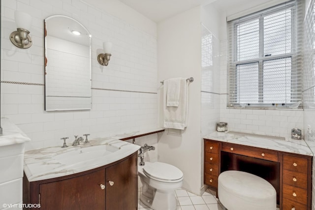 1320 N State Pkwy Unit 2A, Chicago, IL 60610 - bathroom with vanity, tile walls, toilet, and tile patterned flooring