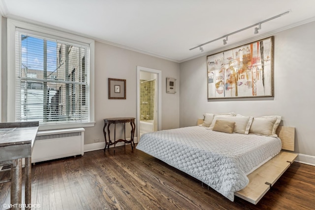 1320 N State Pkwy Unit 2A, Chicago, IL 60610 - bedroom with track lighting, radiator, dark wood-style floors, baseboards, and ornamental molding