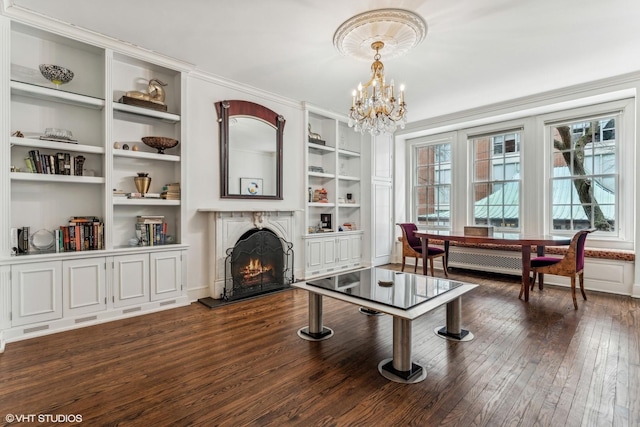 1320 N State Pkwy Unit 2A, Chicago, IL 60610 - sitting room with healthy amount of natural light, dark wood finished floors, a lit fireplace, and a chandelier