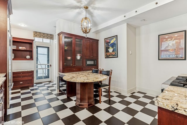 1320 N State Pkwy Unit 2A, Chicago, IL 60610 - dining area with dark floors, baseboards, wine cooler, and a chandelier