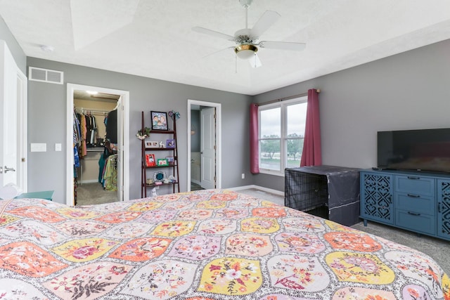 2738 Wharton Way, Normal, IL 61761 - carpeted bedroom with a spacious closet, baseboards, a closet, a ceiling fan, and ensuite bathroom