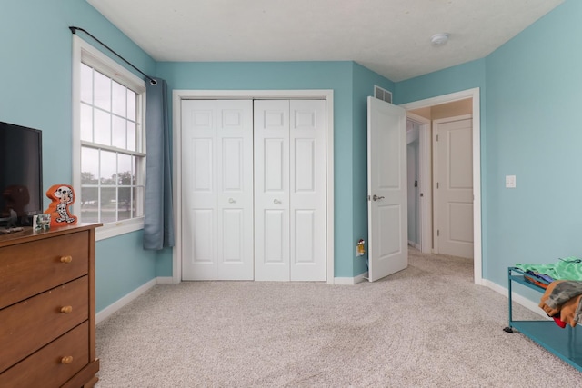 2738 Wharton Way, Normal, IL 61761 - carpeted bedroom with baseboards and a closet