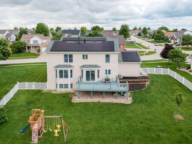 2738 Wharton Way, Normal, IL 61761 - rear view of property with roof mounted solar panels, a playground, a residential view, and roof with shingles
