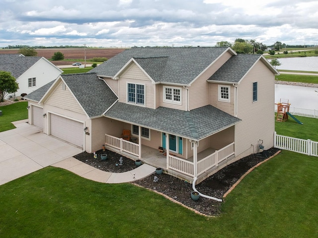 2738 Wharton Way, Normal, IL 61761 - view of front of property featuring a shingled roof, a garage, a porch, concrete driveway, and a water view