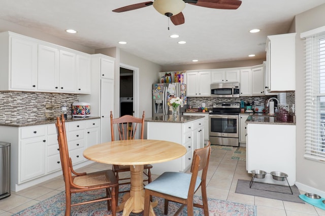 2738 Wharton Way, Normal, IL 61761 - kitchen featuring appliances with stainless steel finishes, a ceiling fan, decorative backsplash, light tile patterned flooring, and recessed lighting