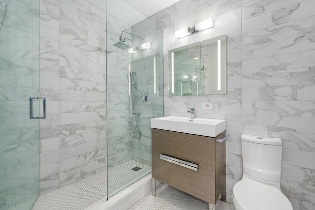 825 N Hudson Ave Unit 1B, Chicago, IL 60610 - full bath with tile walls, a shower stall, vanity, and toilet