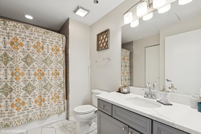 849 N Franklin St Unit 618, Chicago, IL 60610 - bathroom featuring vanity, toilet, marble finish floors, and shower / bath combination with curtain