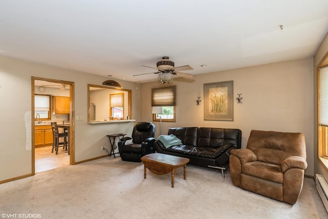 412 Midway Dr, Mundelein, IL 60060 - living area with a ceiling fan, light colored carpet, baseboard heating, and baseboards