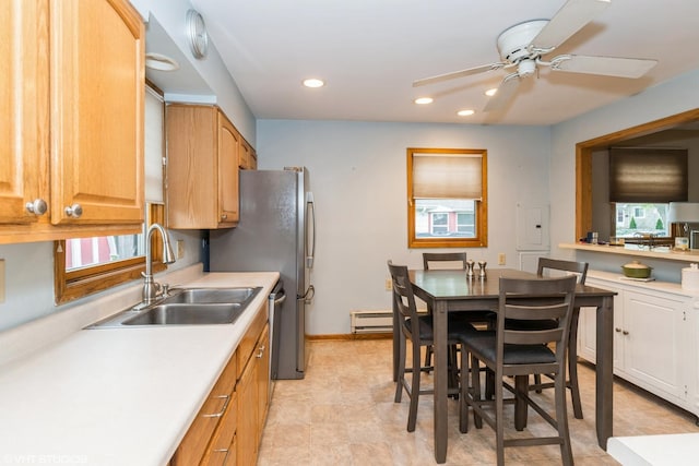 412 Midway Dr, Mundelein, IL 60060 - kitchen with a sink, light countertops, recessed lighting, a ceiling fan, and a baseboard radiator