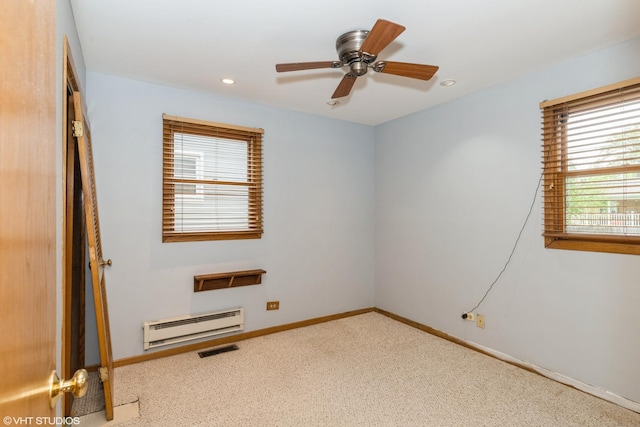 412 Midway Dr, Mundelein, IL 60060 - carpeted spare room featuring a baseboard heating unit, a ceiling fan, baseboards, and recessed lighting