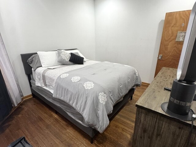 143 E 111th St, Chicago, IL 60628 - bedroom featuring dark wood-type flooring