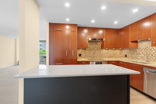 1450 N Astor St Unit 7D, Chicago, IL 60610 - kitchen featuring stainless steel dishwasher, a sink, under cabinet range hood, decorative backsplash, and light countertops
