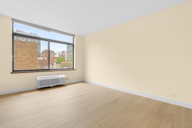 1450 N Astor St Unit 7D, Chicago, IL 60610 - spare room with wood finished floors, baseboards, and a city view