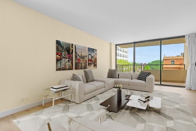 1450 N Astor St Unit 7D, Chicago, IL 60610 - living room featuring wood finished floors, expansive windows, and baseboards