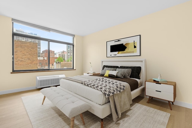 1450 N Astor St Unit 7D, Chicago, IL 60610 - bedroom with baseboards, wood finished floors, multiple windows, and a view of city