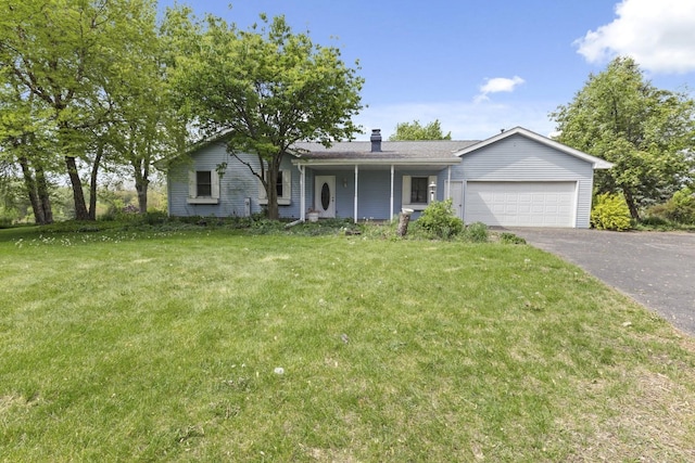 8530 N Kishwaukee Rd, Stillman Valley, IL 61084 - ranch-style home featuring asphalt driveway, a garage, a front lawn, and a chimney