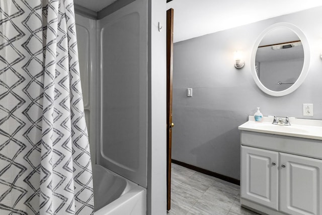 8530 N Kishwaukee Rd, Stillman Valley, IL 61084 - full bathroom featuring vanity, shower / bath combination with curtain, and baseboards