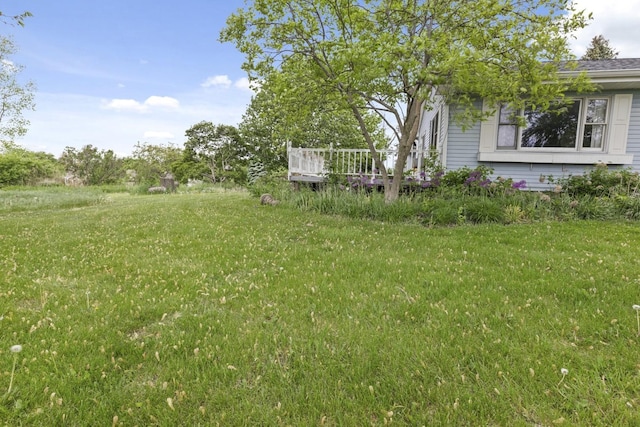 8530 N Kishwaukee Rd, Stillman Valley, IL 61084 - view of grassy yard featuring a deck