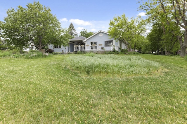 8530 N Kishwaukee Rd, Stillman Valley, IL 61084 - view of green lawn featuring a deck