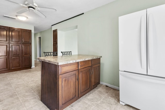8530 N Kishwaukee Rd, Stillman Valley, IL 61084 - kitchen featuring freestanding refrigerator, light countertops, a ceiling fan, light tile patterned floors, and baseboards