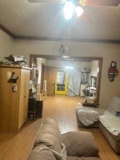 living area with light wood-style floors and a ceiling fan