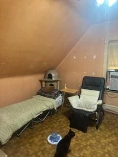 bedroom featuring vaulted ceiling and cooling unit