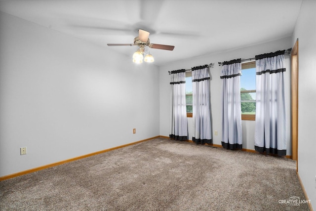 916 Shady Ln, Aurora, IL 60506 - carpeted spare room featuring baseboards and a ceiling fan