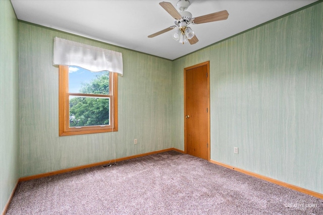 916 Shady Ln, Aurora, IL 60506 - unfurnished room featuring carpet flooring, crown molding, a ceiling fan, and baseboards