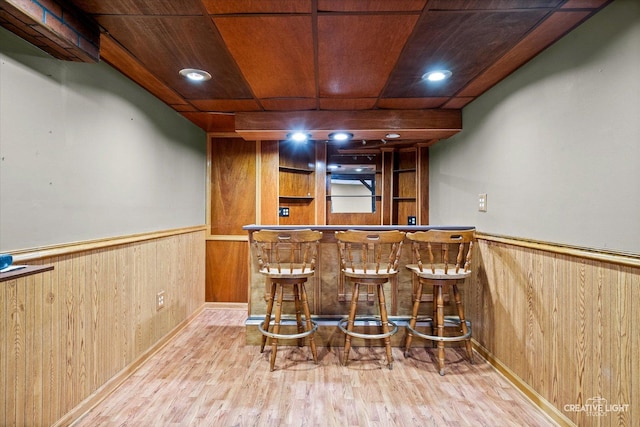 916 Shady Ln, Aurora, IL 60506 - indoor dry bar featuring wood walls, wood finished floors, wainscoting, and wooden ceiling