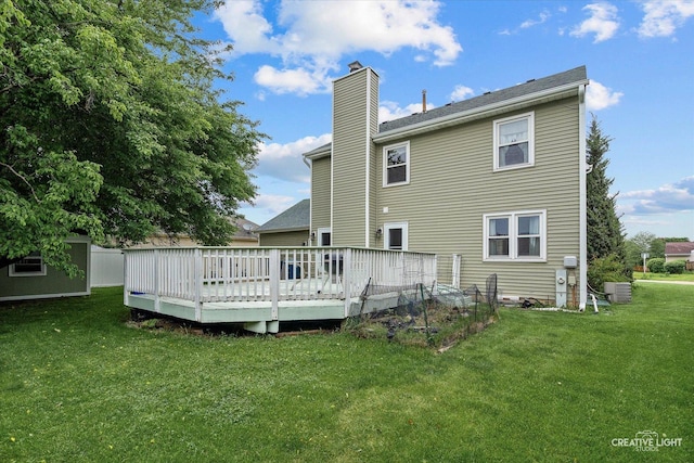 916 Shady Ln, Aurora, IL 60506 - rear view of house with a chimney, a yard, a deck, and central AC
