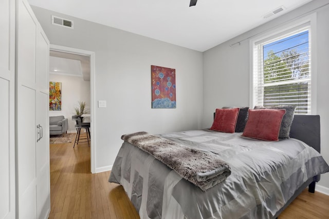 1737 W Balmoral Ave Unit 1A, Chicago, IL 60640 - bedroom with light wood-type flooring, baseboards, and ceiling fan