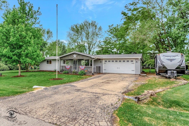 23246 S Malibu Dr, Manhattan, IL 60442 - ranch-style house featuring covered porch, a garage, driveway, and a front lawn
