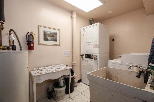 3150 W Bryn Mawr Ave Unit 301, Chicago, IL 60659 - washroom featuring stacked washing machine and dryer, gas water heater, a sink, and light tile patterned floors