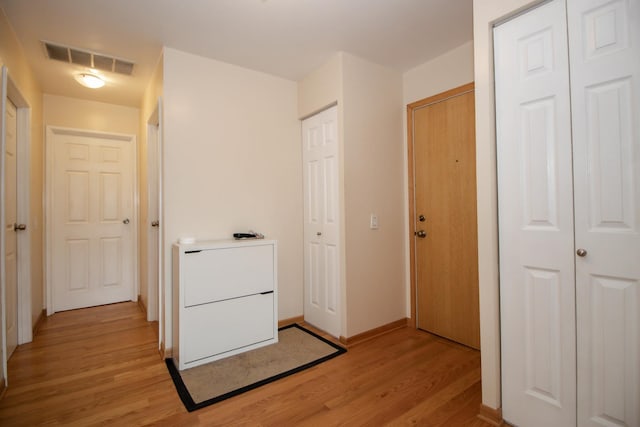 3150 W Bryn Mawr Ave Unit 301, Chicago, IL 60659 - laundry area with light wood finished floors and baseboards