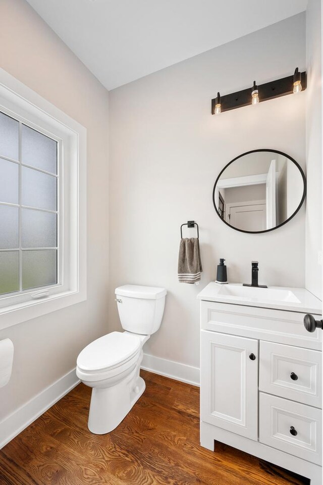 8029 98th St, Palos Hills, IL 60465 - bathroom with baseboards, toilet, and wood finished floors