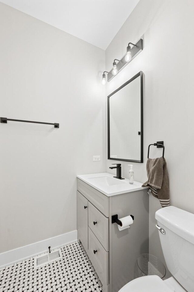 8029 98th St, Palos Hills, IL 60465 - half bathroom featuring toilet, vanity, and baseboards