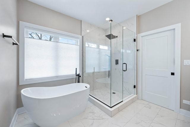 8029 98th St, Palos Hills, IL 60465 - bathroom featuring marble look tile flooring, a freestanding bath, baseboards, and plenty of natural light