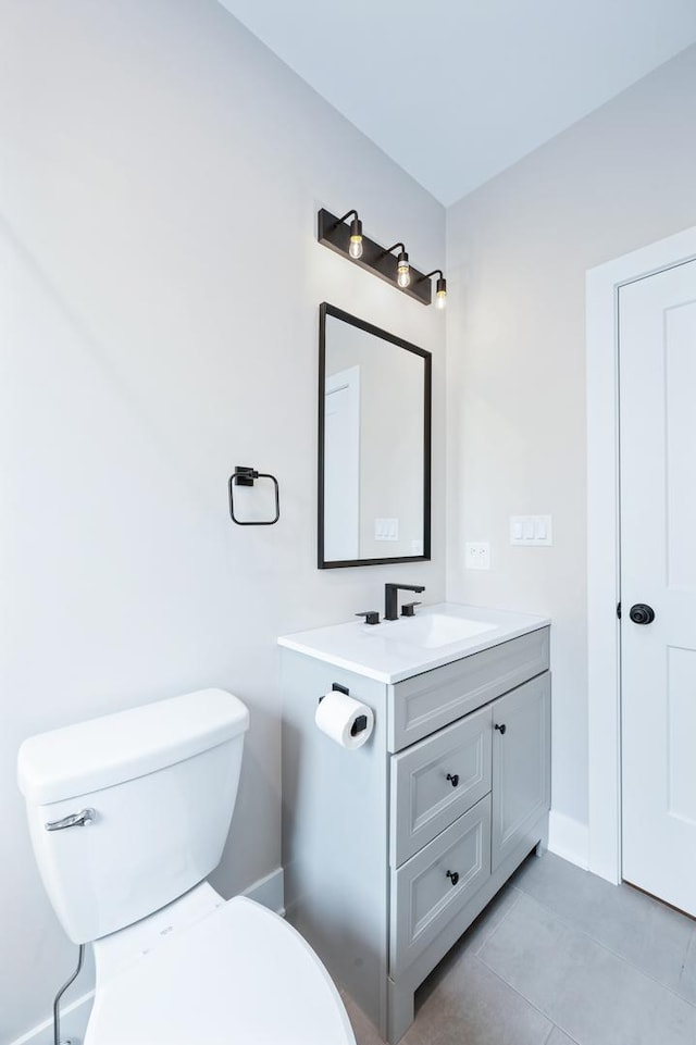 8029 98th St, Palos Hills, IL 60465 - half bath with tile patterned flooring, toilet, vanity, and baseboards