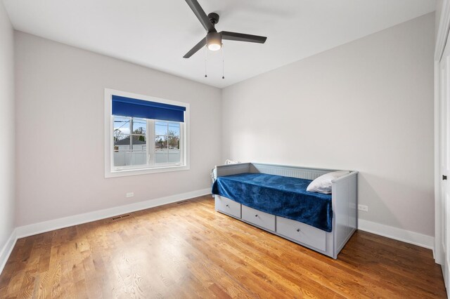 8029 98th St, Palos Hills, IL 60465 - bedroom featuring wood finished floors, baseboards, and ceiling fan