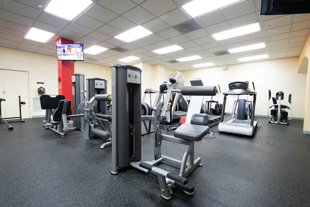 gym featuring a paneled ceiling