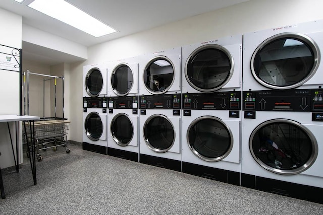 shared laundry with stacked washer / dryer and separate washer and dryer