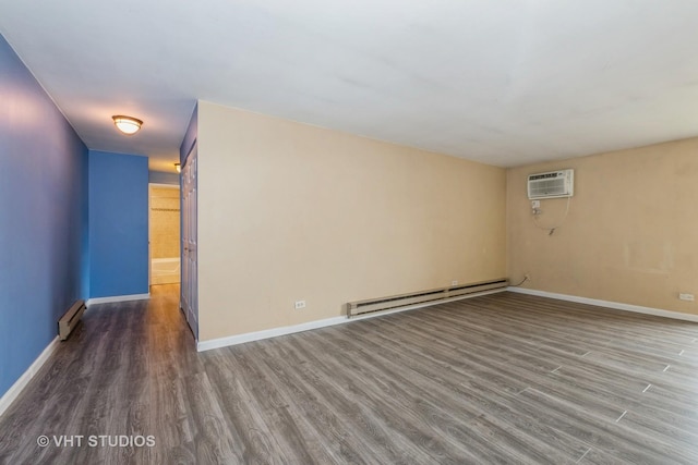 4137 W 97th Pl Unit 311, Oak Lawn, IL 60453 - spare room with baseboard heating, wood finished floors, baseboards, and an AC wall unit